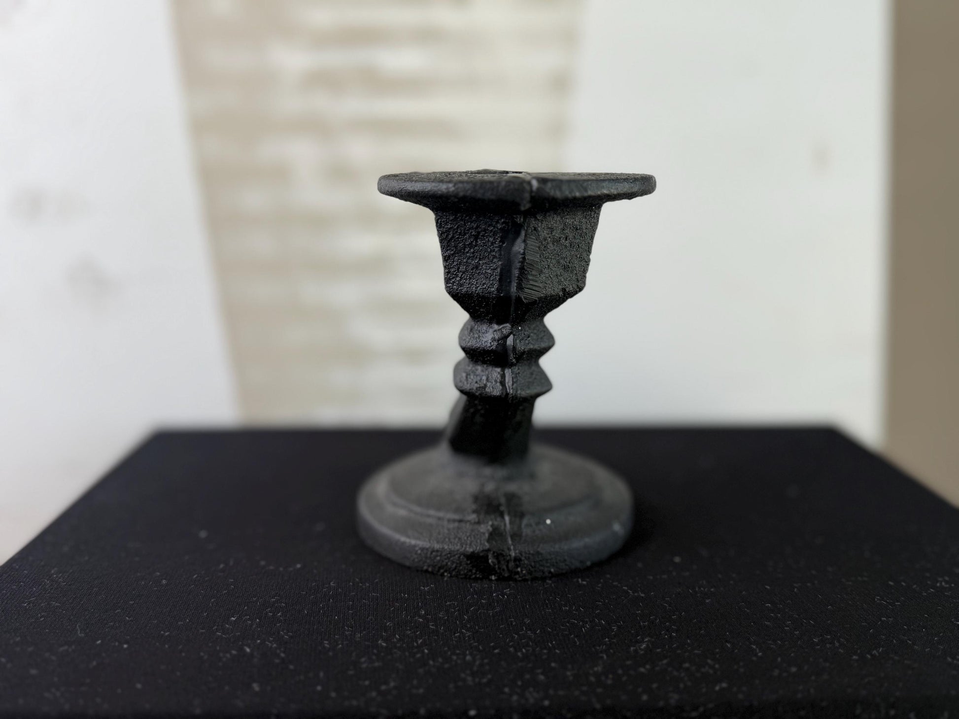 Cast iron candle holder