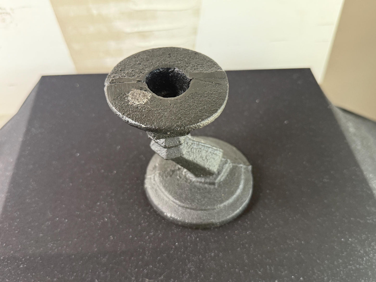 Cast iron candle holder