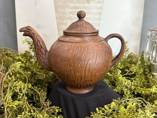 Handmade clay teapot with snake spout